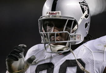 DENVER - OCTOBER 15:  Defensive tackle Terdell Sands #90 of the Oakland Raiders looks on against the Denver Broncos on October 15, 2006 at Invesco Field at Mile High in Denver, Colorado.  The Broncos won 13-3. (Photo by Brian Bahr/Getty Images)