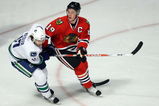 CHICAGO - MAY 05:  Jonathan Toews #19 of the Chicago Blackhawks skates against Ryan Kesler #17 of the Vancouver Canucks during Game Three of the Western Conference Semifinal Round of the 2009 Stanley Cup Playoffs on May 5, 2009 at the United Center in Chicago, Illinois  (Photo by Jonathan Daniel/Getty Images)