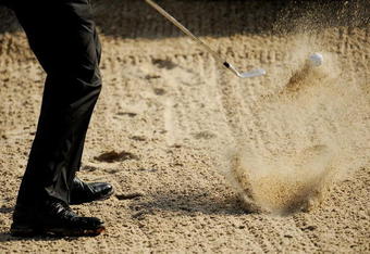 PONTE VEDRA BEACH, FL - MAY 06:  A golfer plays a shot from a bunker during a practice round prior to the start of THE PLAYERS Championship on THE PLAYERS Stadium Course at TPC Sawgrass on May 6, 2009 in Ponte Vedra Beach, Florida.  (Photo by Sam Greenwood/Getty Images)