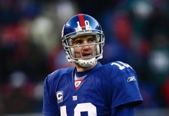 EAST RUTHERFORD, NJ -  JANUARY 11:  Eli Manning #10 of the New York Giants looks on against the Philadelphia Eagles during the NFC Divisional Playoff Game on January 11, 2009 at Giants Stadium in East Rutherford, New Jersey.  The Eagles defeated the Giants 23 -11. (Photo by Chris McGrath/Getty Images)