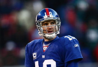 EAST RUTHERFORD, NJ -  JANUARY 11:  Eli Manning #10 of the New York Giants looks on against the Philadelphia Eagles during the NFC Divisional Playoff Game on January 11, 2009 at Giants Stadium in East Rutherford, New Jersey.  The Eagles defeated the Giants 23 -11. (Photo by Chris McGrath/Getty Images)