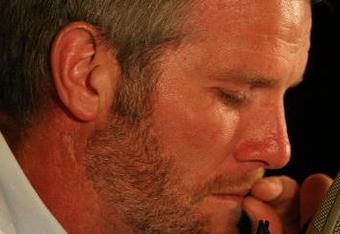 GREEN BAY, WI - MARCH 06: Quarterback Brett Favre of the Green Bay Packers tries to control his emotions at his retirement press conference on March 6, 2008 at Lambeau Field in Green Bay, Wisconsin. (Photo by Jonathan Daniel/Getty Images)