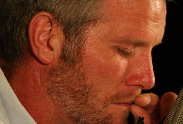 GREEN BAY, WI - MARCH 06: Quarterback Brett Favre of the Green Bay Packers tries to control his emotions at his retirement press conference on March 6, 2008 at Lambeau Field in Green Bay, Wisconsin. (Photo by Jonathan Daniel/Getty Images)