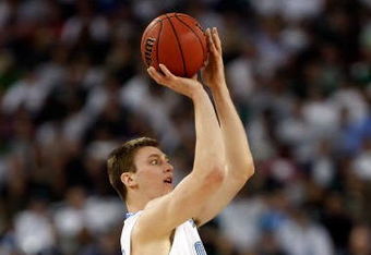 DETROIT - APRIL 06:  Tyler Hansbrough #50 of the North Carolina Tar Heels goes up for a shot over Goran Suton #14 of the Michigan State Spartans in the first half during the 2009 NCAA Division I Men's Basketball National Championship game at Ford Field on April 6, 2009 in Detroit, Michigan.  (Photo by Streeter Lecka/Getty Images)