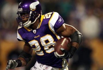 MINNEAPOLIS - JANUARY 4:   Adrian Peterson #28 of the Minnesota Vikings carries the ball in the first half against the Philadelphia Eagles during the NFC Wild Card playoff game on January 4,2009 at the Hubert H. Humphrey Metrodome in Minneapolis, Minnesota. (Photo by Elsa/Getty Images)