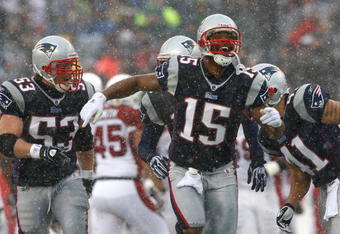 FOXBORO, MA - DECEMBER 21:  Kelley Washington #15 of the New England Patriots reacts after a defensive play against the Arizona Cardinals at Gillette Stadium on December 21, 2008 in Foxboro, Massachusetts. The Patriots won 47-7. (Photo by Jim Rogash/Getty Images)