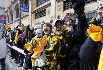 PITTSBURGH - FEBRUARY 03: Fans react during a parade for the Pittsburgh Steelers to celebrate winning Super Bowl XLIII on February 3, 2009 in Pittsburgh, Pennsylvania.  (Photo by Gregory Shamus/Getty Images)