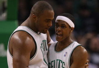 BOSTON - FEBRUARY 10:  Rajon Rondo #9 of the Boston Celtics congratulates teammate Glen Davis #11 after Davis made the basket and drew the foul in the second half against San Antonio Spurs on February 10, 2008 at the TD Banknorth Garden in Boston, Massachusetts. The Boston Celtics defeated the San Antonio Spurs 98-90. NOTE TO USER: User expressly acknowledges and agrees that, by downloading and or using this Photograph, user is consenting to the terms and conditions of the Getty Images License Agreement.  (Photo by Elsa/Getty Images)