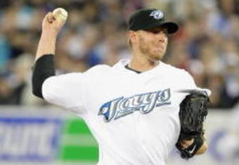 TORONTO - APRIL 6: Roy Halladay #32 of the Toronto Blue Jays delivers the pitch during the Opening Day game against the Detroit Tigers at the Rogers Centre on April 6, 2009 in Toronto, Ontario. (Photo by: Dave Sandford/Getty Images)