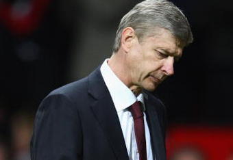 MANCHESTER, ENGLAND - APRIL 29:  Arsenal Manager Arsene Wenger walks off at the end of the UEFA Champions League Semi Final First Leg match between Manchester United and Arsenal at Old Trafford on April 29, 2009 in Manchester, England.  (Photo by Clive Brunskill/Getty Images)