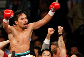LAS VEGAS - MAY 02:  Manny Pacquiao of the Philippines celebrates after knocking out Ricky Hatton of England in the second round of their junior welterweight title fight at the MGM Grand Garden Arena May 2, 2009 in Las Vegas, Nevada.  (Photo by Ethan Miller/Getty Images)