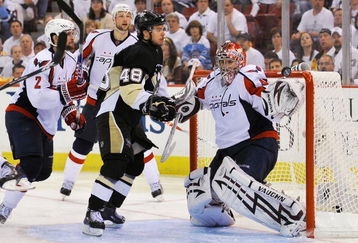 PITTSBURGH - MAY 06:  Goaltender Simeon Varlamov #40 of the Washington Capitals attempts to make a save as Tyler Kennedy #48 of the Pittsburgh Penguins moves in for the rebound during Game Three of the Eastern Conference Semifinal Round of the 2009 Stanley Cup Playoffs at Mellon Arena on May 6, 2009 in Pittsburgh, Pennsylvania.  (Photo by Jamie Sabau/Getty Images)