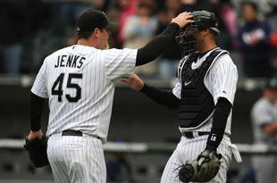 CHICAGO - APRIL 29:  Bobby Jenks #45 of the Chicago White Sox congratulates teammate A.J. Pierzynski #12 after a win against the Seattle Mariners on April 29, 2009 at U.S. Cellular Field in Chicago, Illinois. The White Sox defeated the Mariners 6-3. (Photo by Jonathan Daniel/Getty Images)