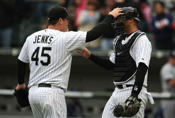CHICAGO - APRIL 29:  Bobby Jenks #45 of the Chicago White Sox congratulates teammate A.J. Pierzynski #12 after a win against the Seattle Mariners on April 29, 2009 at U.S. Cellular Field in Chicago, Illinois. The White Sox defeated the Mariners 6-3. (Photo by Jonathan Daniel/Getty Images)