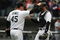 CHICAGO - APRIL 29:  Bobby Jenks #45 of the Chicago White Sox congratulates teammate A.J. Pierzynski #12 after a win against the Seattle Mariners on April 29, 2009 at U.S. Cellular Field in Chicago, Illinois. The White Sox defeated the Mariners 6-3. (Photo by Jonathan Daniel/Getty Images)