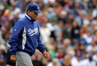 DENVER - APRIL 26:  Manager Joe Torre #6 of the Los Angeles Dodgers heads to the mound to remove starting pitcher Clayton Kershaw in the fifth inning against the Colorado Rockies at Coors Field on April 26, 2009 in Denver, Colorado. The Rockies and defeated Dodgers 10-4.  (Photo by Doug Pensinger/Getty Images)