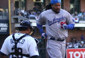 SAN DIEGO, CA- APRIL 6:  Manny Ramirez #99 of the Los Angeles Dodgers scores against the San Diego Padres during their Opening Day game on April 6, 2009 at Petco Park in San Diego, California. (Photo by Donald Miralle/Getty Images)