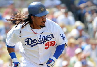 LOS ANGELES, CA - APRIL 19:  Manny Ramirez #99 of the Los Angeles Dodgers runs to first against the Colorado Rockies during the game at Dodger Stadium on April 19, 2009 in Los Angeles, California.  (Photo by Harry How/Getty Images)