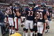 CHICAGO - DECEMBER 07: Adewale Ogunleye #93, Brian Urlacher #54, Charles Tillman #33 and Mike Brown #30 of the Chicago Bears stand in front of heaters to warm up during a game against the Jacksonville Jaguars on December 7, 2008 at Soldier Field in Chicago, Illinois. The Bears defeated the Jaguars 23-10. (Photo by Jonathan Daniel/Getty Images)