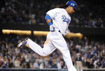 LOS ANGELES, CA - APRIL 30:  Manny Ramirez #99 of the Los Angeles Dodgers hits a homerun for a 4-3 lead against the San Diego Padres during the third inning at Dodger Stadium on April 30, 2009 in Los Angeles, California.  (Photo by Harry How/Getty Images)