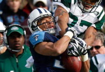 NASHVILLE, TN - NOVEMBER 23:  Cortland Finnegan #31 of the Tennessee Titans intercepts this pass intended for Laveranues Coles #87 of the New York Jets during the game at LP Field on November 23, 2008 in Nashville, Tennessee.  (Photo by Kevin C. Cox/Getty Images)