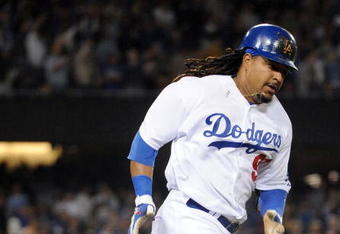 LOS ANGELES, CA - APRIL 30:  Manny Ramirez #99 of the Los Angeles Dodgers hits a homerun for a 4-3 lead against the San Diego Padres during the third inning at Dodger Stadium on April 30, 2009 in Los Angeles, California.  (Photo by Harry How/Getty Images)