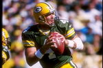 21 Sep 1997: Quarterback Brett Favre #4 of the Green Bay Packers drops back to pass during the Packers 38-32 win over the Minnesota Vikings at Lambeau Field in Green Bay, Wisconsin.