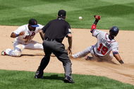 NEW YORK - AUGUST 09:  Yunel Escobar #19 of the Atlanta Braves is safe on his sixth inning steal attempt as Jose Reyes #7 of the New York Mets can't handle the throw during their game on August 9, 2007 at Shea Stadium in the Flushing neighborhood of the Queens borough of New York City. Escobar advanced to third on the play and later scored.The Braves defeated the Mets 7-6.  (Photo by Jim McIsaac/Getty Images)