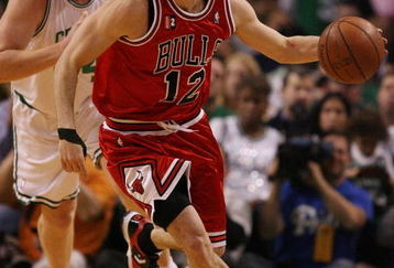 BOSTON - MAY 02:  Kirk Hinrich #12 of the Chicago Bulls heads down court as Brian Scalabrine #44 of the Boston Celtics defends in Game Seven of the Eastern Conference Quarterfinals during the 2009 NBA Playoffs at TD Banknorth Garden on May 2, 2009 in Boston, Massachusetts. The Celtics defeated the Bulls 109-99. NOTE TO USER: User expressly acknowledges and agrees that, by downloading and or using this photograph, User is consenting to the terms and conditions of the Getty Images License Agreement.  (Photo by Elsa/Getty Images)