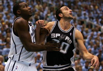 SALT LAKE CITY - MAY 26:  Paul Milsap #24 of the Utah Jazz and Manu Ginobili #20 of the San Antonio Spurs battle for position in the first quarter of Game Three of the Western Conference Finals during the 2007 NBA Playoffs at the EnergySolutions Arena on May 26, 2007 in Salt Lake City, Utah. NOTE TO USER: User expressly acknowledges and agrees that, by downloading and/or using this Photograph, user is consenting to the terms and conditions of the Getty Images License Agreement.  (Photo by Lisa Blumenfeld/Getty Images)