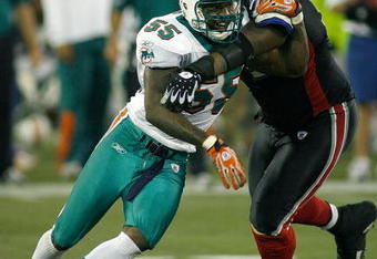 TORONTO, ON - DECEMBER 07: Joey Porter #55 of the Miami Dolphins gets around Jason Peters #71 of the Buffalo Bills  on December 7, 2008  at Rogers Centre in Toronto, Ontario, Canada. The Dolphins won 16-3.  (Photo by Rick Stewart/Getty Images)