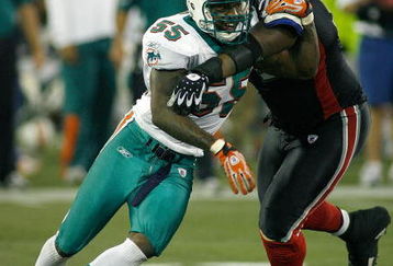 TORONTO, ON - DECEMBER 07: Joey Porter #55 of the Miami Dolphins gets around Jason Peters #71 of the Buffalo Bills  on December 7, 2008  at Rogers Centre in Toronto, Ontario, Canada. The Dolphins won 16-3.  (Photo by Rick Stewart/Getty Images)