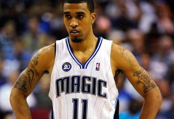 ORLANDO, FL - APRIL 22:  Courtney Lee #11 of the Orlando Magic watches the action against the Philadelphia 76ers in Game Two of the Eastern Conference Quarterfinals during the 2009 NBA Playoffs at Amway Arena April 22, 2009 in Orlando, Florida.   NOTE TO USER: User expressly acknowledges and agrees that, by downloading and/or using this Photograph, user is consenting to the terms and conditions of the Getty Images License Agreement.  (Photo by Sam Greenwood/Getty Images)