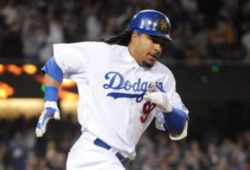 LOS ANGELES, CA - APRIL 30:  Manny Ramirez #99 of the Los Angeles Dodgers hits a homerun for a 4-3 lead against the San Diego Padres during the third inning at Dodger Stadium on April 30, 2009 in Los Angeles, California.  (Photo by Harry How/Getty Images)