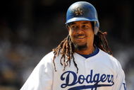 LOS ANGELES, CA - APRIL 19:  Manny Ramirez #99 of the Los Angeles Dodgers on base against the Colorado Rockies during the game at Dodger Stadium on April 19, 2009 in Los Angeles, California.  (Photo by Harry How/Getty Images)