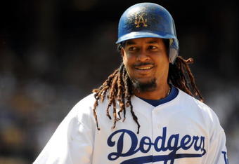 LOS ANGELES, CA - APRIL 19:  Manny Ramirez #99 of the Los Angeles Dodgers on base against the Colorado Rockies during the game at Dodger Stadium on April 19, 2009 in Los Angeles, California.  (Photo by Harry How/Getty Images)