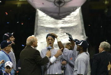 3 Feb 2002:   Quarterback Tom Brady #12 of the New England Patriots speaks with sports commentator Terry Bradshaw, left, at the podium after Super Bowl XXXVI between the New England Patriots and the St. Louis Rams at the Superdome in New Orleans, Louisiana. The Patriots defeated the Rams 20-17 with a 48-yard field goal by kicker Adam Vinatieri. DIGITAL IMAGE.  Mandatory Credit: Brian Bahr/Getty Images