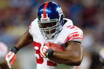 ST. LOUIS, MO - SEPTEMBER 14:  Justin Tuck #91 of the New York Giants carries the ball during the game against the St. Louis Rams at Edward Jones Dome on September 14, 2008 in St. Louis, Missouri. (Photo by Dilip Vishwanat/Getty Images)