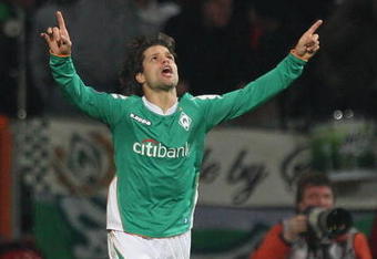 BREMEN, GERMANY - MARCH 13: Diego of Werder Bremen celebrates his goal during the UEFA Cup Round of 16 second leg match between Werder Bremen and Rangers at t he Weserstadion on March 13, 2008 in Bremen, Germany.  (Photo by Laurence Griffiths/Getty Images)