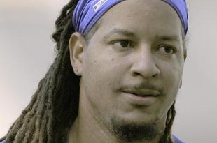 LOS ANGELES, CA - APRIL 15:  Manny Ramirez #99 of the Los Angeles Dodgers looks on with his long hair during batting practice before the game against the San Francisco Giants on April 15, 2009 at Dodger Stadium in Los Angeles, California.  All Major League Baseball players wore #42 in honor of Jackie Robinson day.  (Photo by Kevork Djansezian/Getty Images)