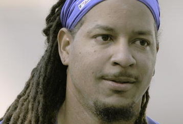 LOS ANGELES, CA - APRIL 15:  Manny Ramirez #99 of the Los Angeles Dodgers looks on with his long hair during batting practice before the game against the San Francisco Giants on April 15, 2009 at Dodger Stadium in Los Angeles, California.  All Major League Baseball players wore #42 in honor of Jackie Robinson day.  (Photo by Kevork Djansezian/Getty Images)