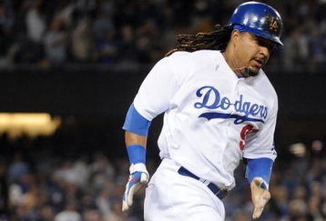 LOS ANGELES, CA - APRIL 30:  Manny Ramirez #99 of the Los Angeles Dodgers hits a homerun for a 4-3 lead against the San Diego Padres during the third inning at Dodger Stadium on April 30, 2009 in Los Angeles, California.  (Photo by Harry How/Getty Images)