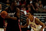CHICAGO - FEBRUARY 12:  Dwyane Wade #3 of the Miami Heat looks to pass as Derrick Rose #1 of the Chicago Bulls defends on February 12, 2009 at the United Center in Chicago, Illinois. The Heat defeated the Bulls 95-93. NOTE TO USER: User expressly acknowledges and agreees that, by downloading and/or using this Photograph, User is consenting to the terms and conditions of the Getty Images License Agreement.  (Photo by Jonathan Daniel/Getty Images)