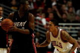 CHICAGO - FEBRUARY 12:  Dwyane Wade #3 of the Miami Heat looks to pass as Derrick Rose #1 of the Chicago Bulls defends on February 12, 2009 at the United Center in Chicago, Illinois. The Heat defeated the Bulls 95-93. NOTE TO USER: User expressly acknowledges and agreees that, by downloading and/or using this Photograph, User is consenting to the terms and conditions of the Getty Images License Agreement.  (Photo by Jonathan Daniel/Getty Images)