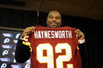ASHBURN, VA - FEBRUARY 27:  Albert Haynesworth posese with his new jersey at a press conference after signing a 7-year contract worth approximately $100 million with the Washington Redskins on February 27, 2009 at Redskins Park in Ashburn, Virginia.  (Photo by Mitchell Layton/Getty Images)