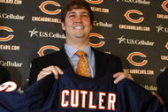 LAKE FOREST, IL - APRIL 3: Quarterback Jay Cutler of the Chicago Bears holds up his #6 jersey after he was introduced as their new quarterback during a press conference on April 3, 2009 at Halas Hall in Lake Forest, Illinois. (Photo by Jim Prisching/Getty Images)