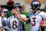 ENGLEWOOD, CO - MAY 03:  Quarterback Kyle Orton #8 has the ball jokingly tipped form his hands by  sixth round draft pick rookie quarterback Tom Brandslater #3 during Denver Broncos Minicamp at the Broncos training facility on May 3, 2009 in Englewood, Colorado.  (Photo by Doug Pensinger/Getty Images)