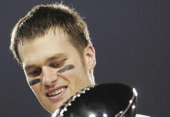 JACKSONVILLE, FLORIDA - FEBRUARY 06:  Quarterback Tom Brady #12 of the New England Patriots celebrates with the Lombardi trophy after defeating the Philadelphia Eagles in Super Bowl XXXIX at Alltel Stadium on February 6, 2005 in Jacksonville, Florida.  The Patriots defeated the Eagles 24-21.  (Photo by Jed Jacobsohn/Getty Images)