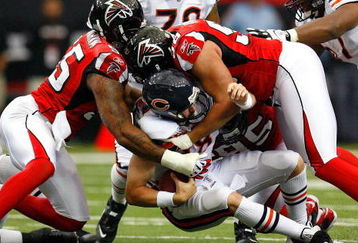 ATLANTA - OCTOBER 12:  Quarterback Kyle Orton #18 of the Chicago Bears is sacked by John Abraham #55 and Jamaal Anderson #98 of the Atlanta Falcons during the game at the Georgia Dome on October 12, 2008 in Atlanta, Georgia.  (Photo by Kevin C. Cox/Getty Images)