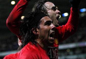 BOLTON, UNITED KINGDOM - JANUARY 17:  Dimitar Berbatov (R) of Manchester United celebrates with team mate Carlos Teve after scoring in the final minutes during the Barclays Premier League match between Bolton Wanderers and Manchester United at the Reebok stadium on January 17, 2009 in Bolton, England.  (Photo by Hamish Blair/Getty Images)